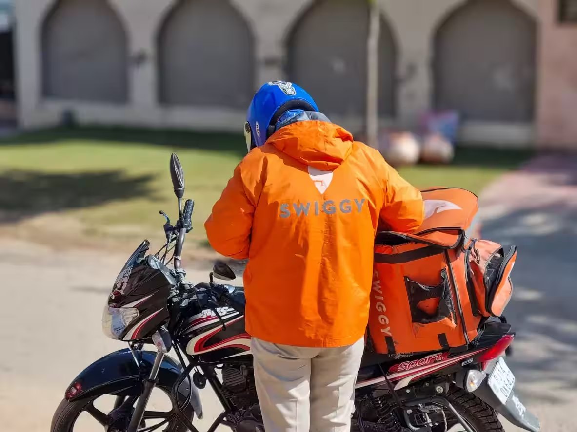 Delivery rider loading an insulated order bag